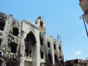 Damage of the outside westrn facade and the minaret. Here in general the west facade of space 02 and the minaret 03 are seen..
