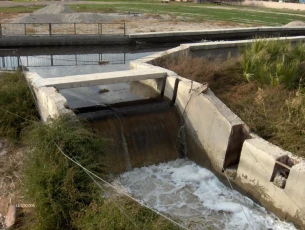 A concrete irrigation canal in the Ghouta of Damascus