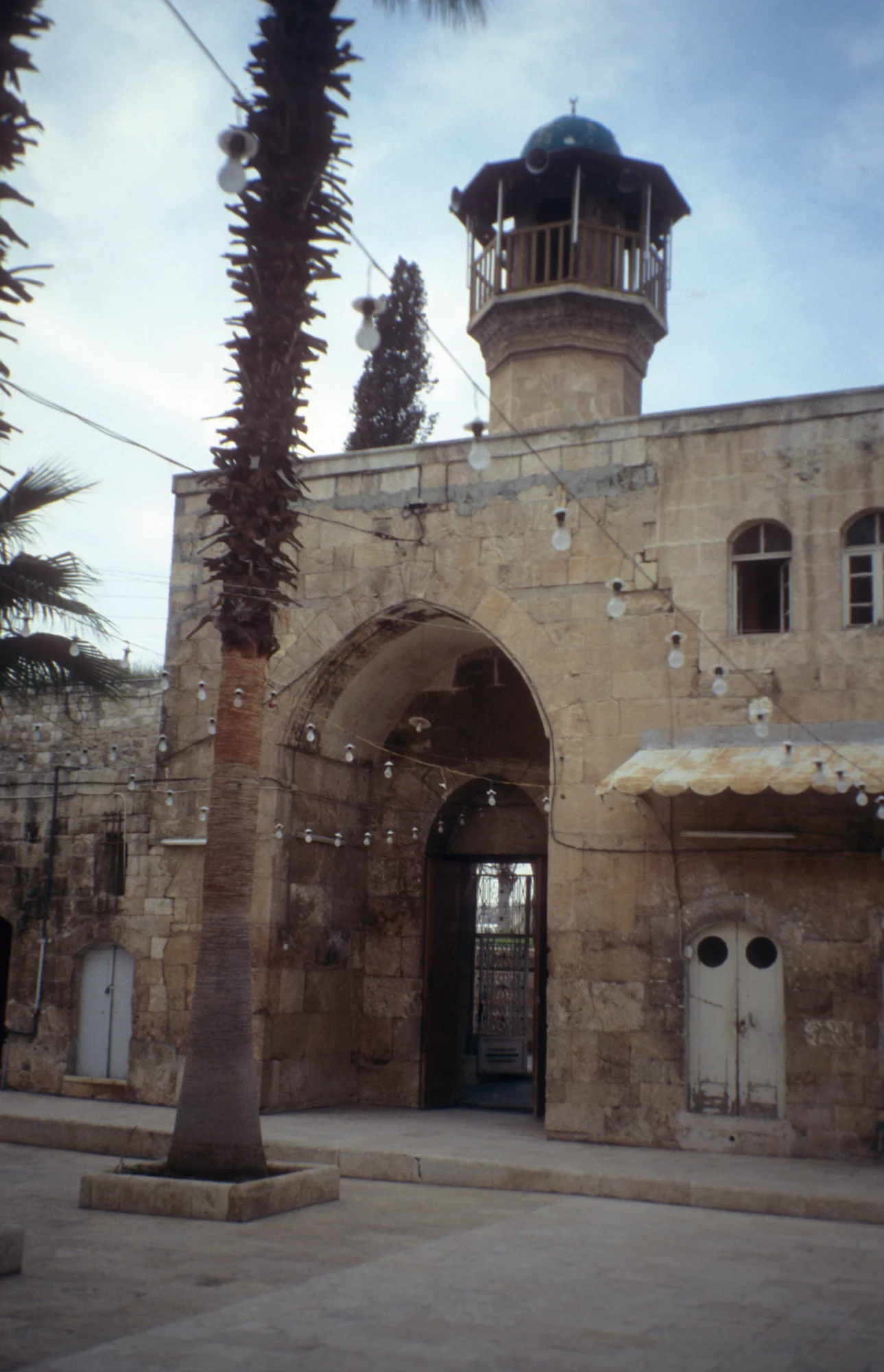 Al-Madrasa as-Sultaniyya, interior view of southern facade - entrance and minaret