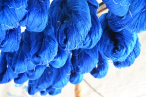 Hanging dyed silk to dry after washing it in cold water