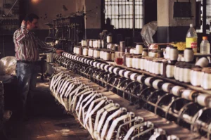 Preparation of spools in the textile factory of the Mezannar family