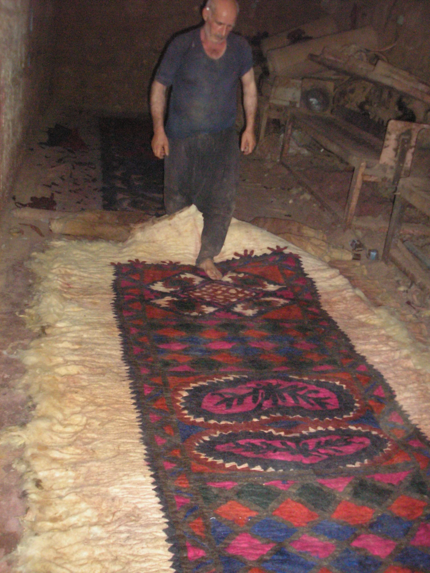 A carpet manufacturer from Al-Bab rolls out a finished felt carpet