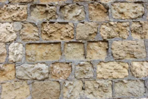 Damage pattern, use of incompatiböe material, sandstone with cement mortar joints, leading to detachements, Cordoba, Spain