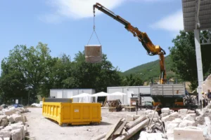 Rubble management, use of crane for removal of rubble stones from San Salvatore a Campi, Perugia, Italy